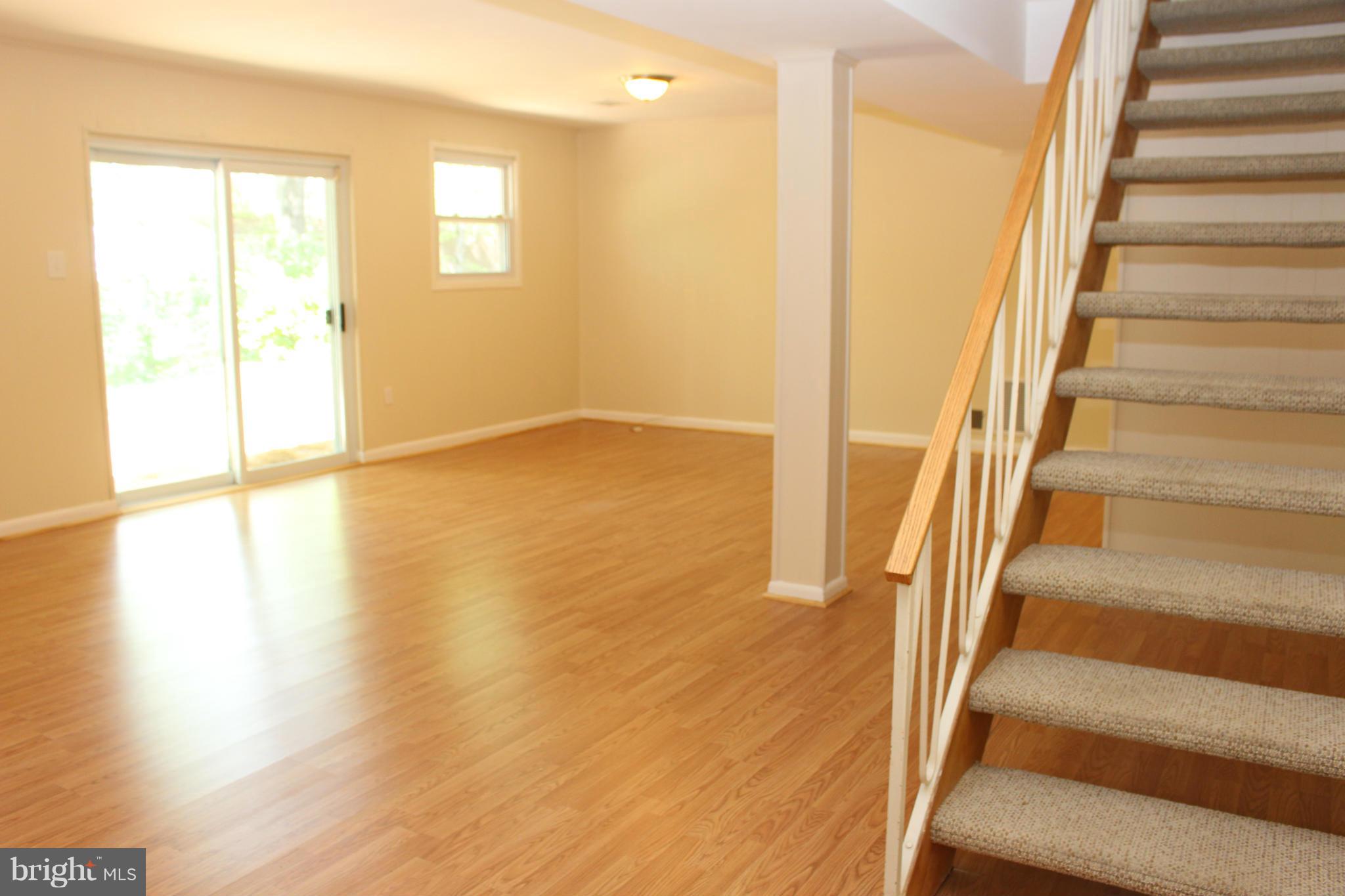 6218 Tyner Street Springfield, VA 22152 - Photo 19 of 30 Open rec room with walk-out to patio