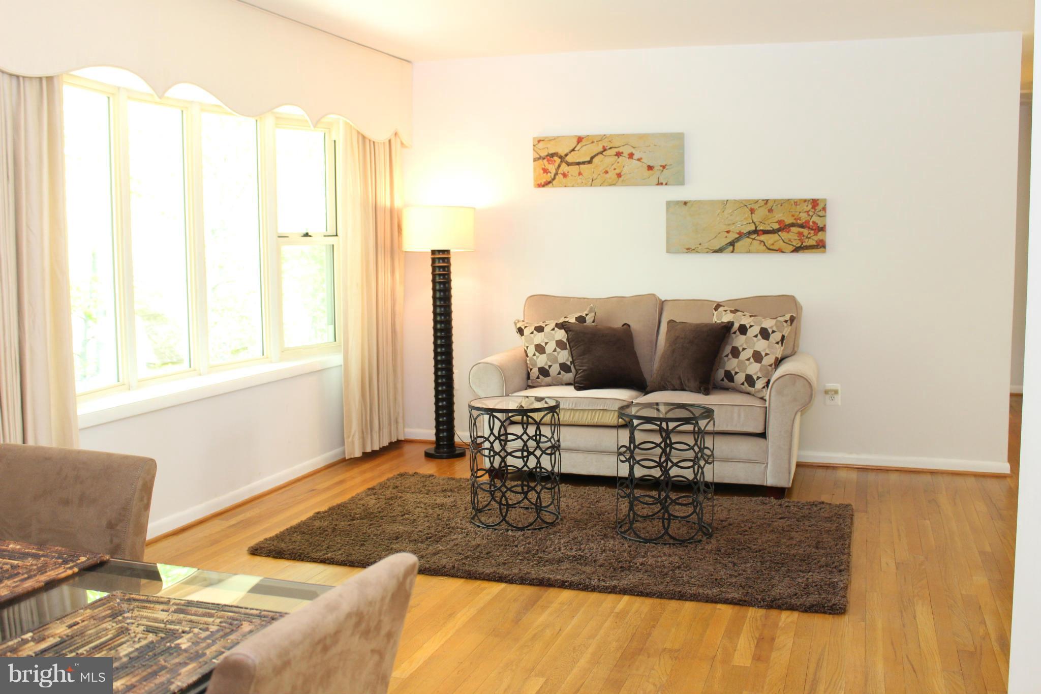 Living room with bright bay window