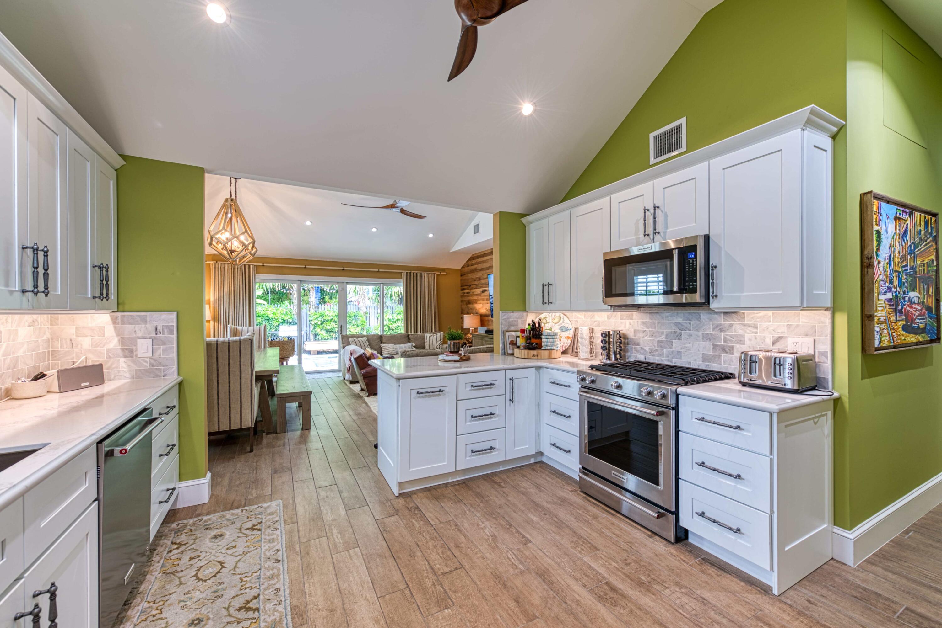 805 Shavers Lane Key West, FL 33040 - Photo 11 of 32 a kitchen with a sink wooden floor and stainless steel appliances