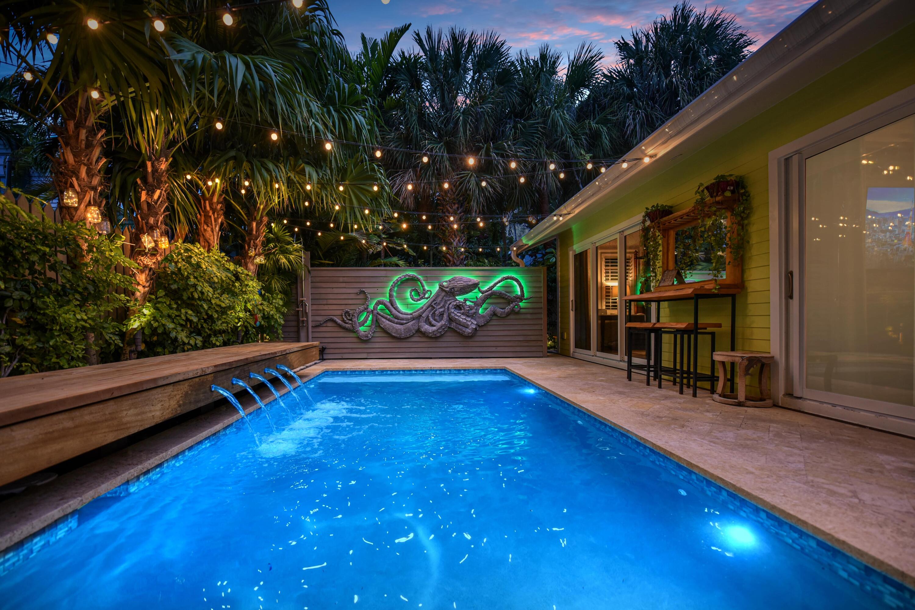 805 Shavers Lane Key West, FL 33040 - Photo 19 of 32 a view of swimming pool with seating area and trees in the background