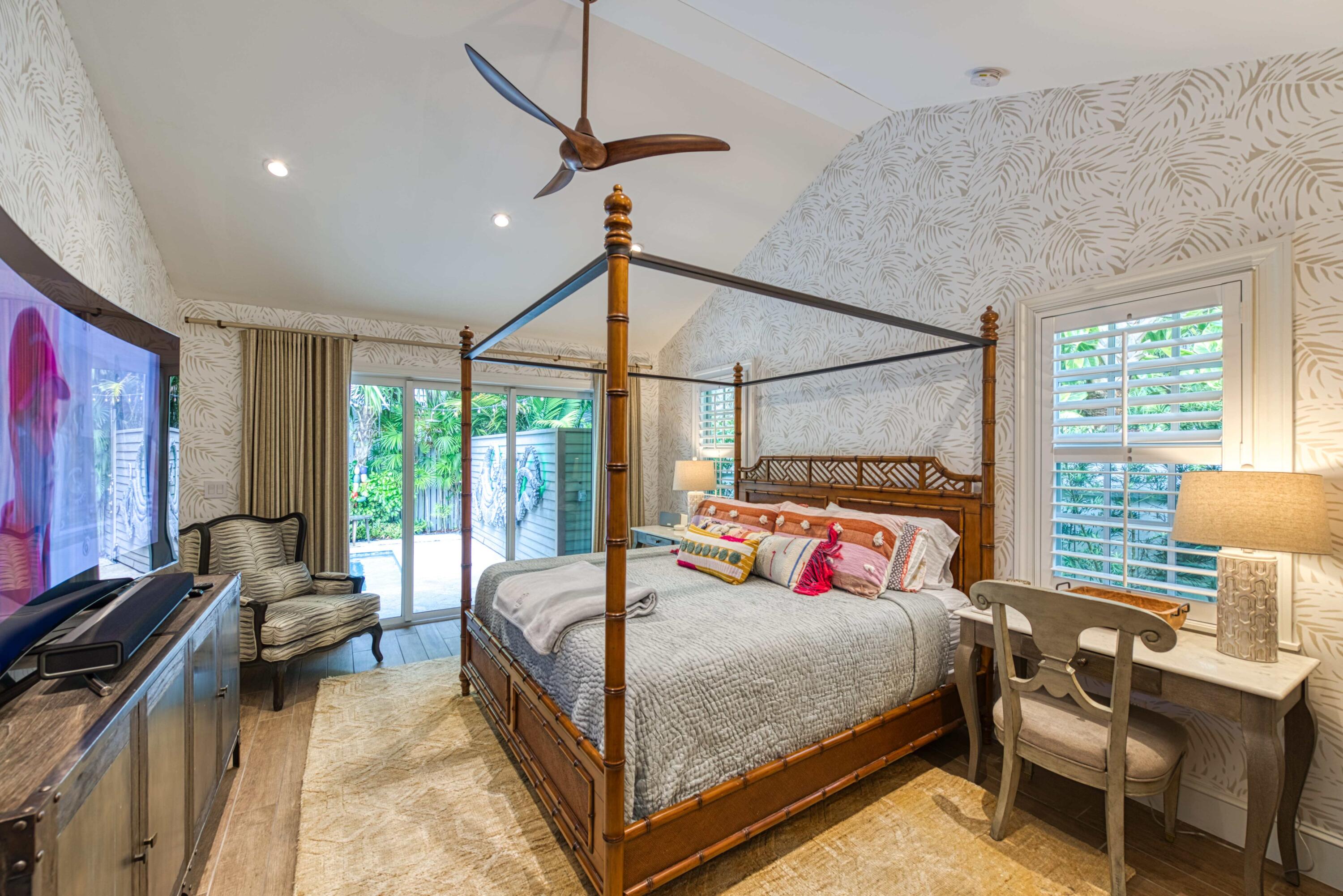805 Shavers Lane Key West, FL 33040 - Photo 22 of 32 a bedroom with a bed window and a table in it