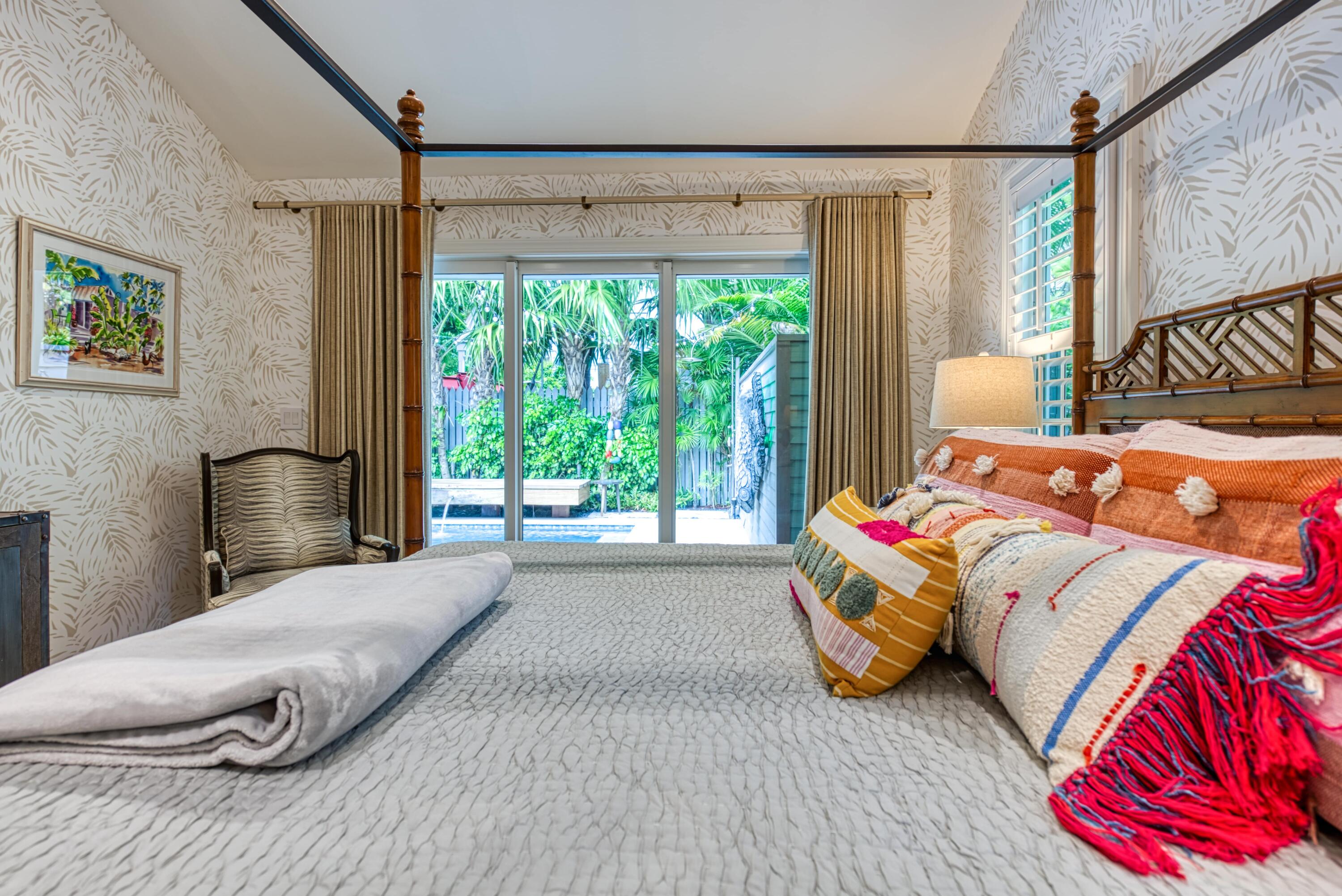 805 Shavers Lane Key West, FL 33040 - Photo 23 of 32 a bedroom with a bed and a large window
