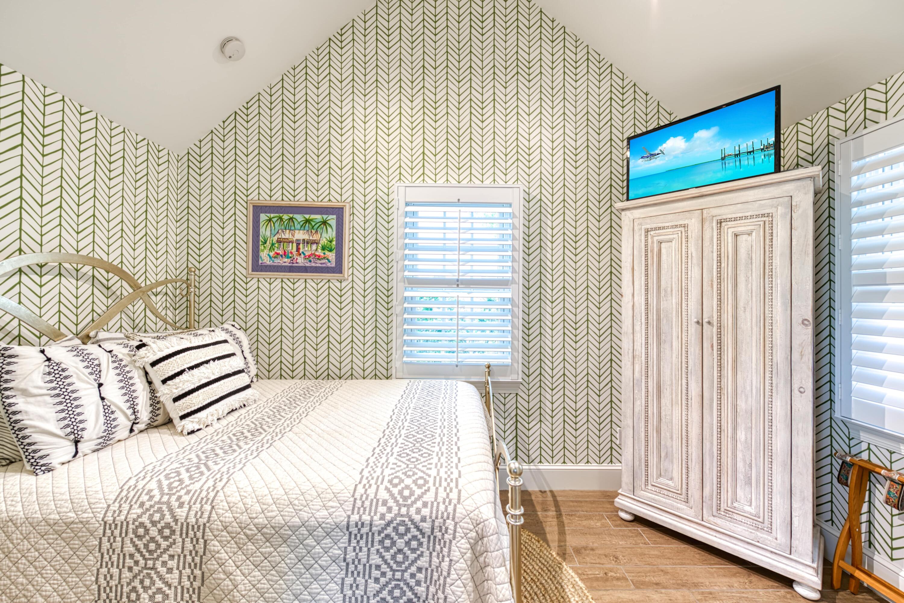 805 Shavers Lane Key West, FL 33040 - Photo 6 of 32 a bedroom with a bed and a window