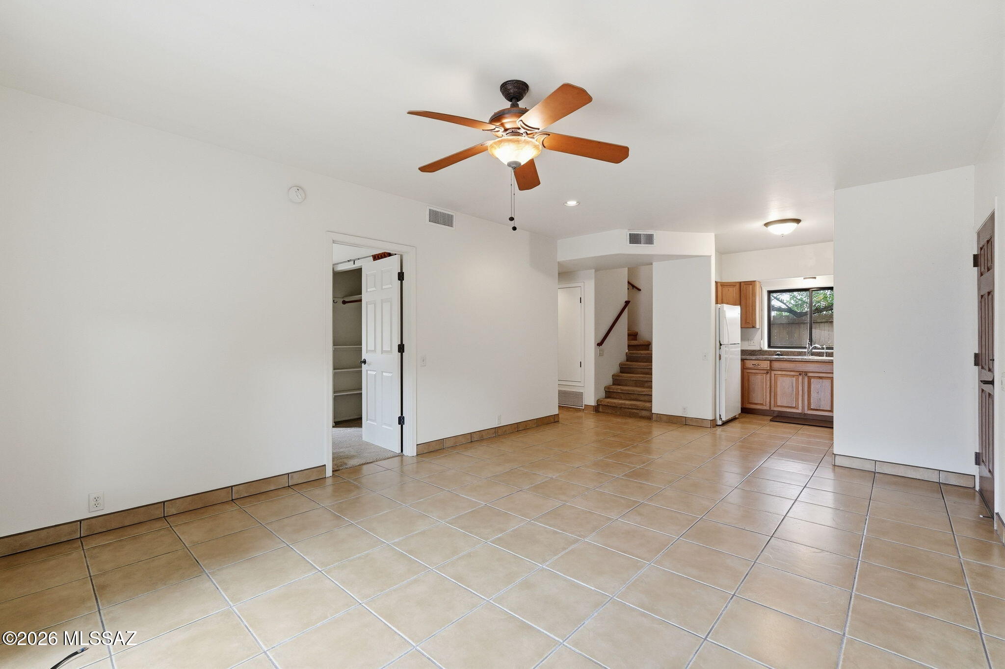 1125 East Kleindale Road Tucson, AZ 85719 - Photo 33 of 49 a view of a livingroom with a ceiling fan and window