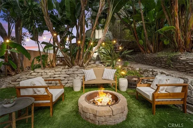 a view of an house with backyard space and patio