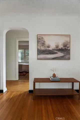 a living room with furniture flowerpot and window