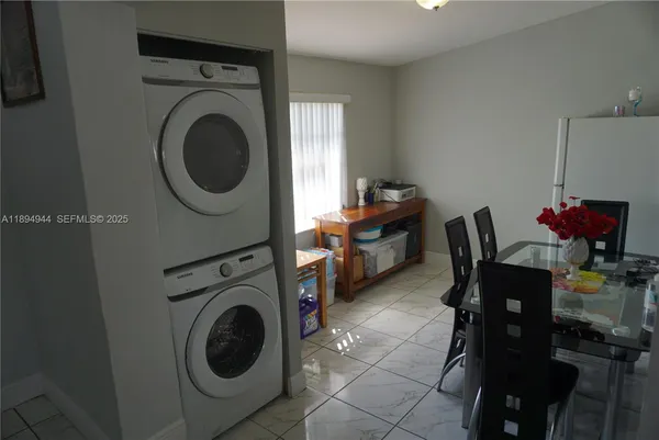 a view of a backyard with large trees