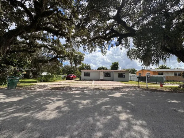 a view of a town with large trees