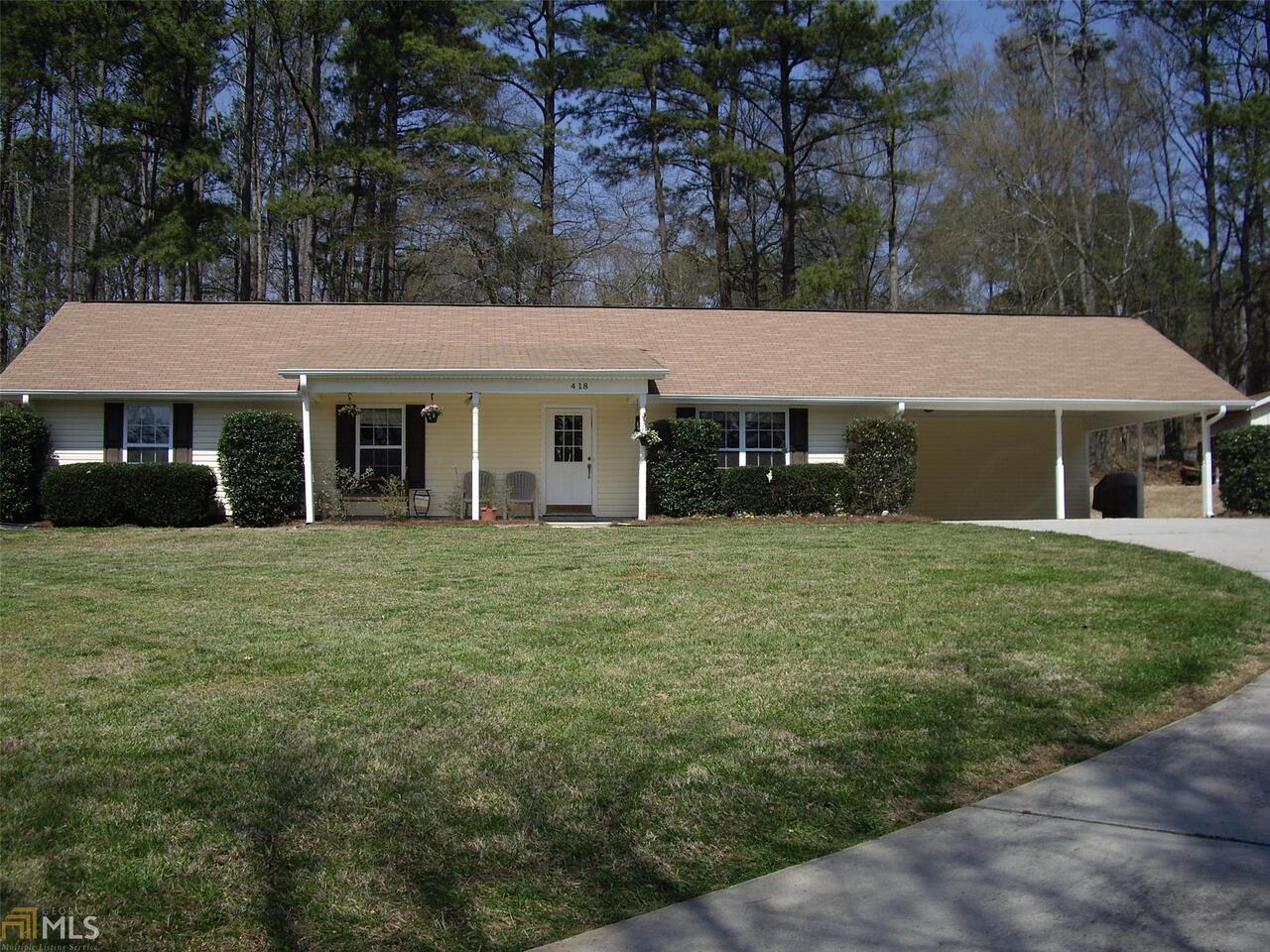 418 Tara Road Jonesboro, GA 30238 - Photo 1 of 1 a front view of a house with a garden