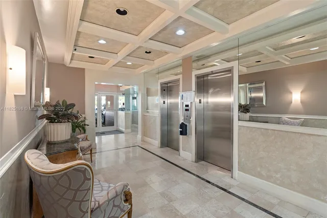 a living room with furniture a flat screen tv and a large window