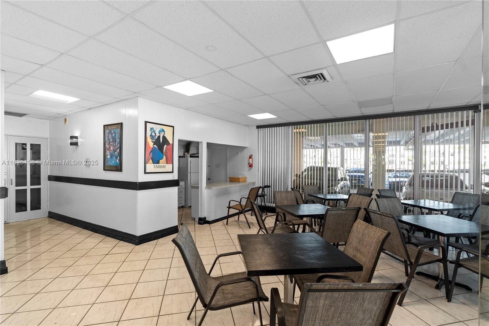 1410 South Ocean Drive, Unit 208 Hollywood, FL 33019 - Photo 23 of 48 a living room with furniture a flat screen tv and a large window