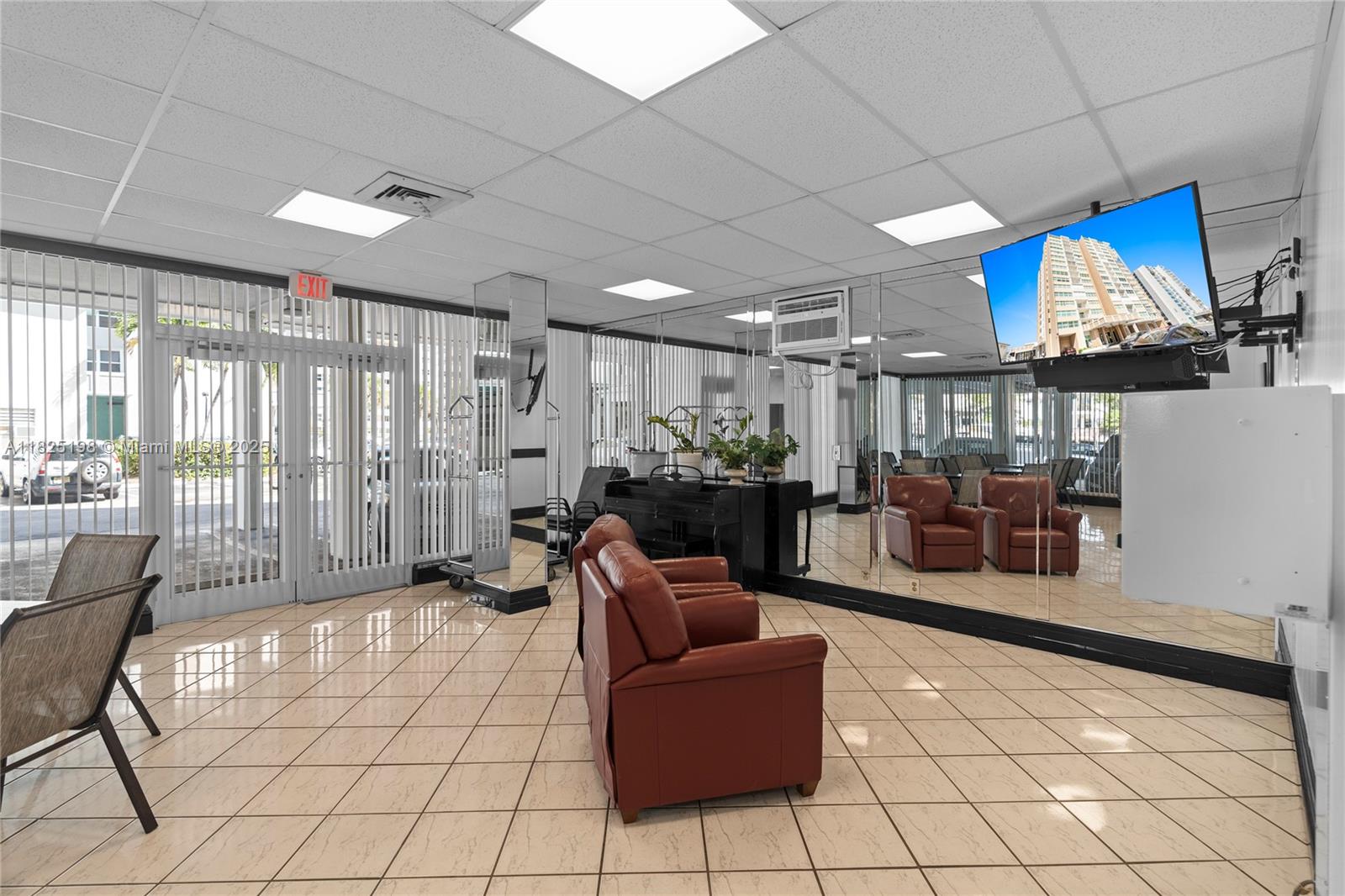 1410 South Ocean Drive, Unit 208 Hollywood, FL 33019 - Photo 24 of 48 a living room with furniture and a large window