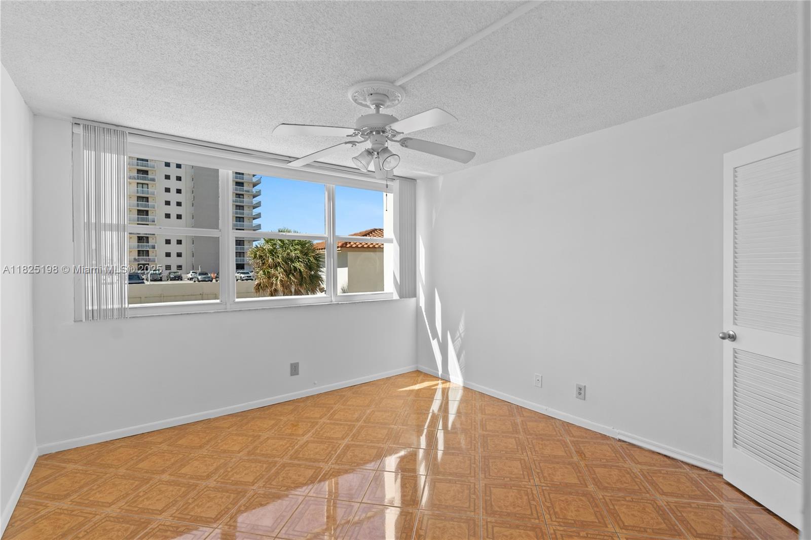 1410 South Ocean Drive, Unit 208 Hollywood, FL 33019 - Photo 43 of 48 a view of a big room with windows and chandelier fan