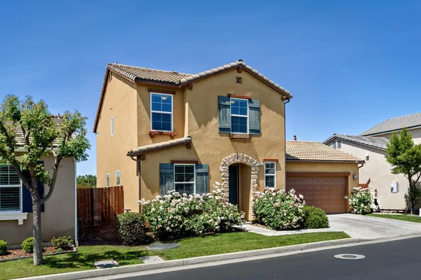 front view of a house with a yard
