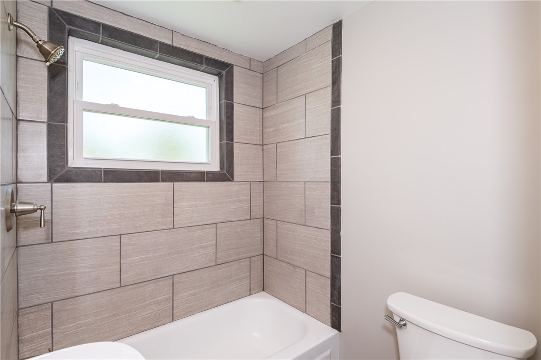 1217 Jasper Road Xenia, OH 45385 - Photo 42 of 62 This hall bathroom features elegant tiling and a well-maintained tub for comfortable living.