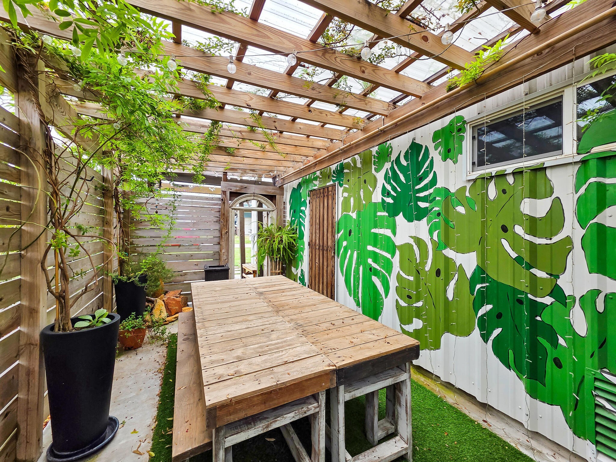 894-896 South Crystal Beach Road Crystal Beach, TX 77650 - Photo 14 of 40 a view of a patio with table and chairs and potted plants