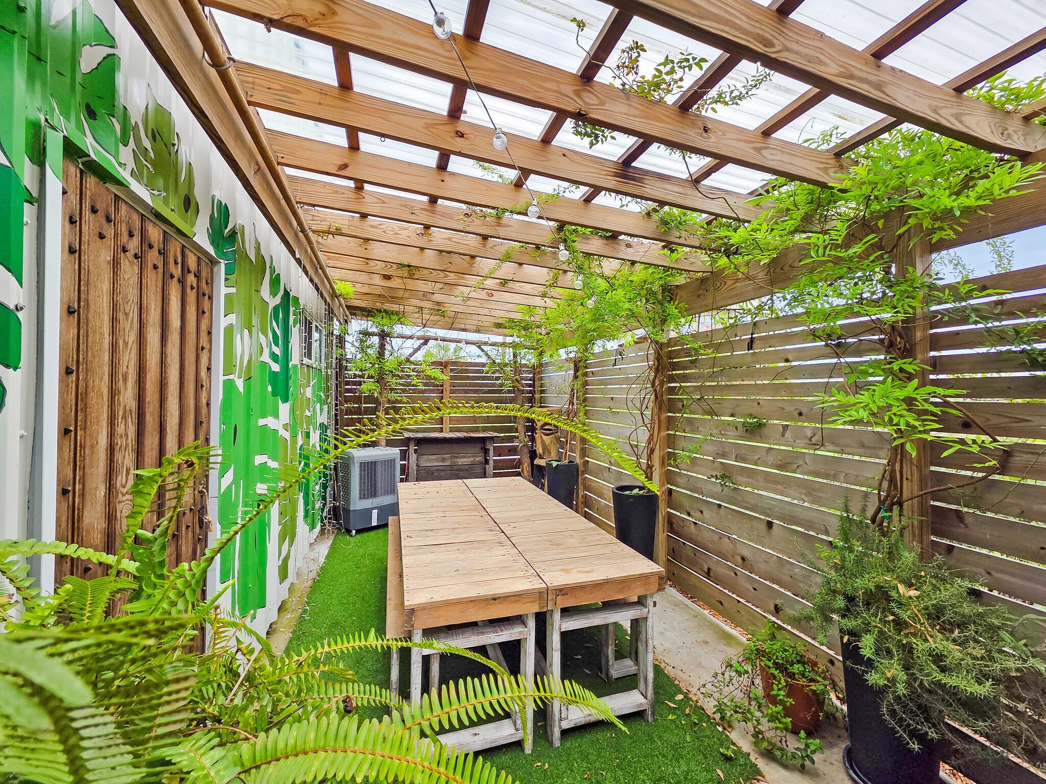 894-896 South Crystal Beach Road Crystal Beach, TX 77650 - Photo 15 of 40 a view of a patio with table and chairs and potted plants