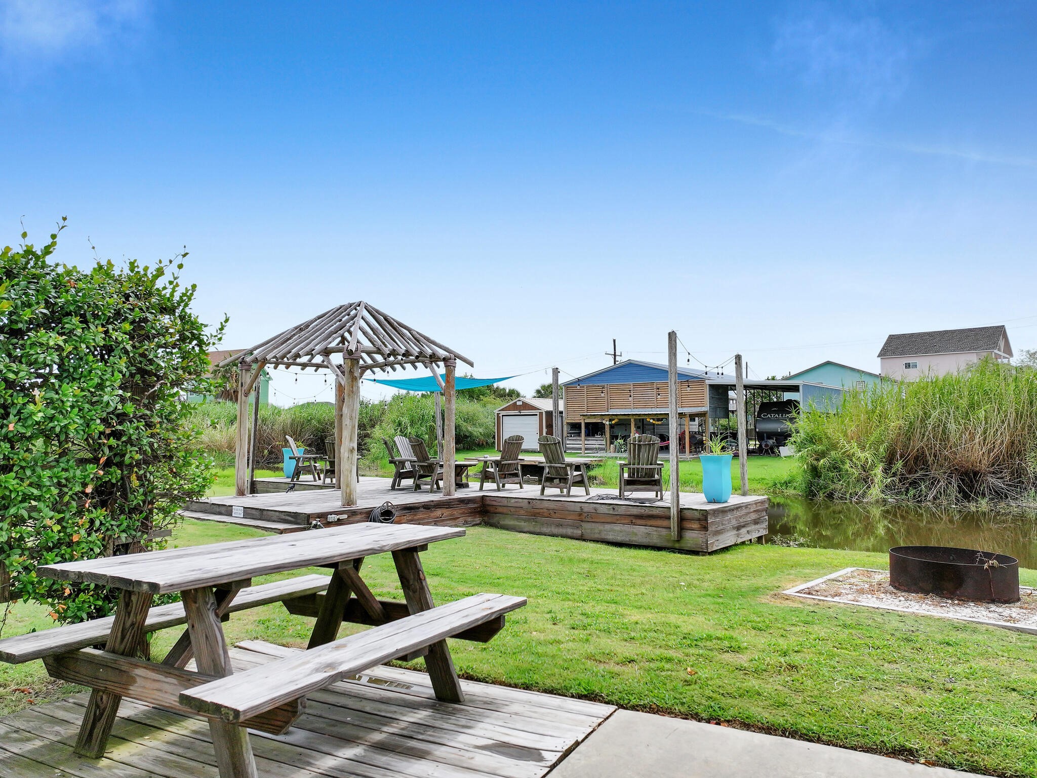 894-896 South Crystal Beach Road Crystal Beach, TX 77650 - Photo 19 of 40 a view of a chairs and table in the patio