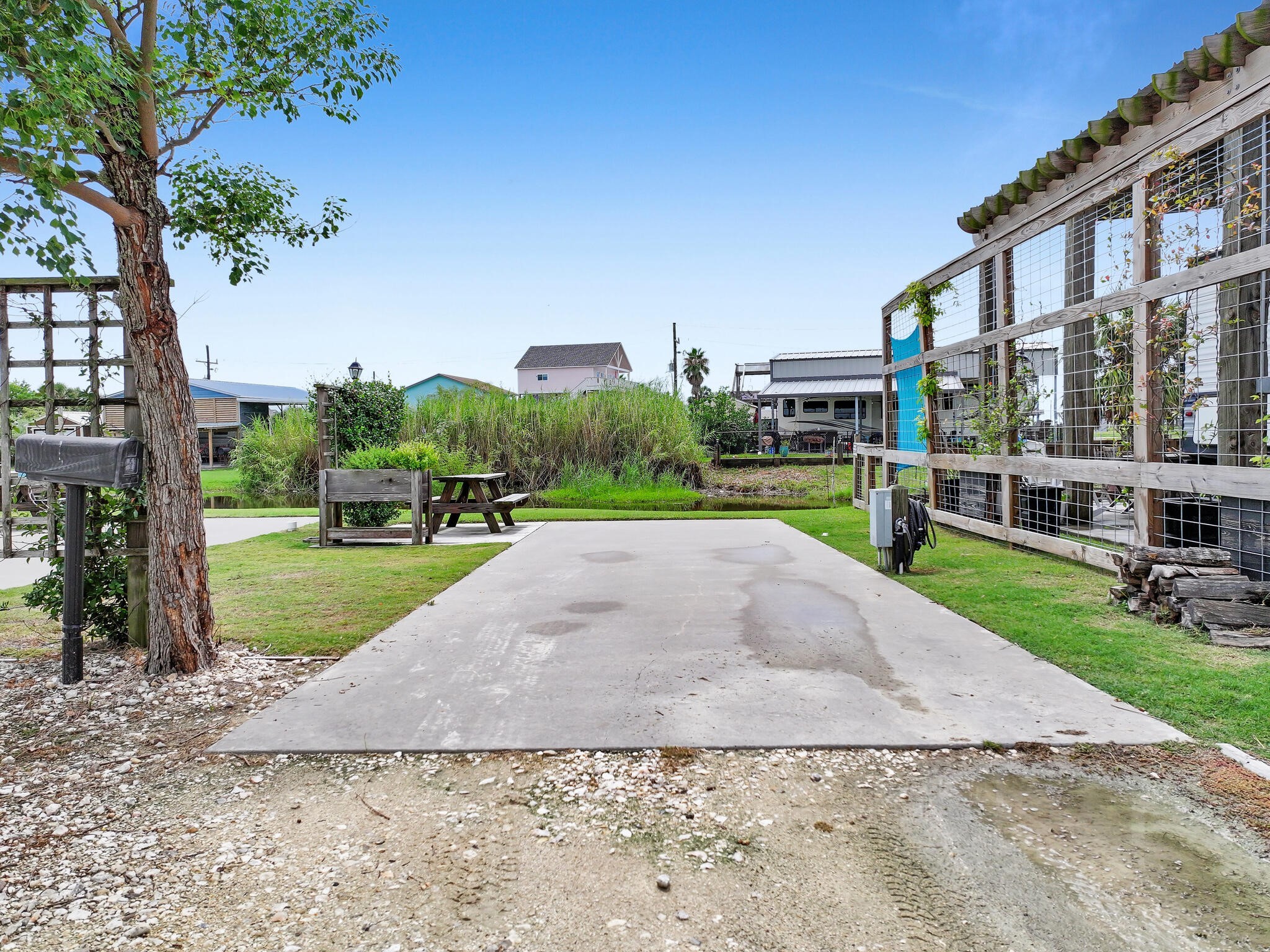 894-896 South Crystal Beach Road Crystal Beach, TX 77650 - Photo 25 of 40 a view of a park with of a house and large trees