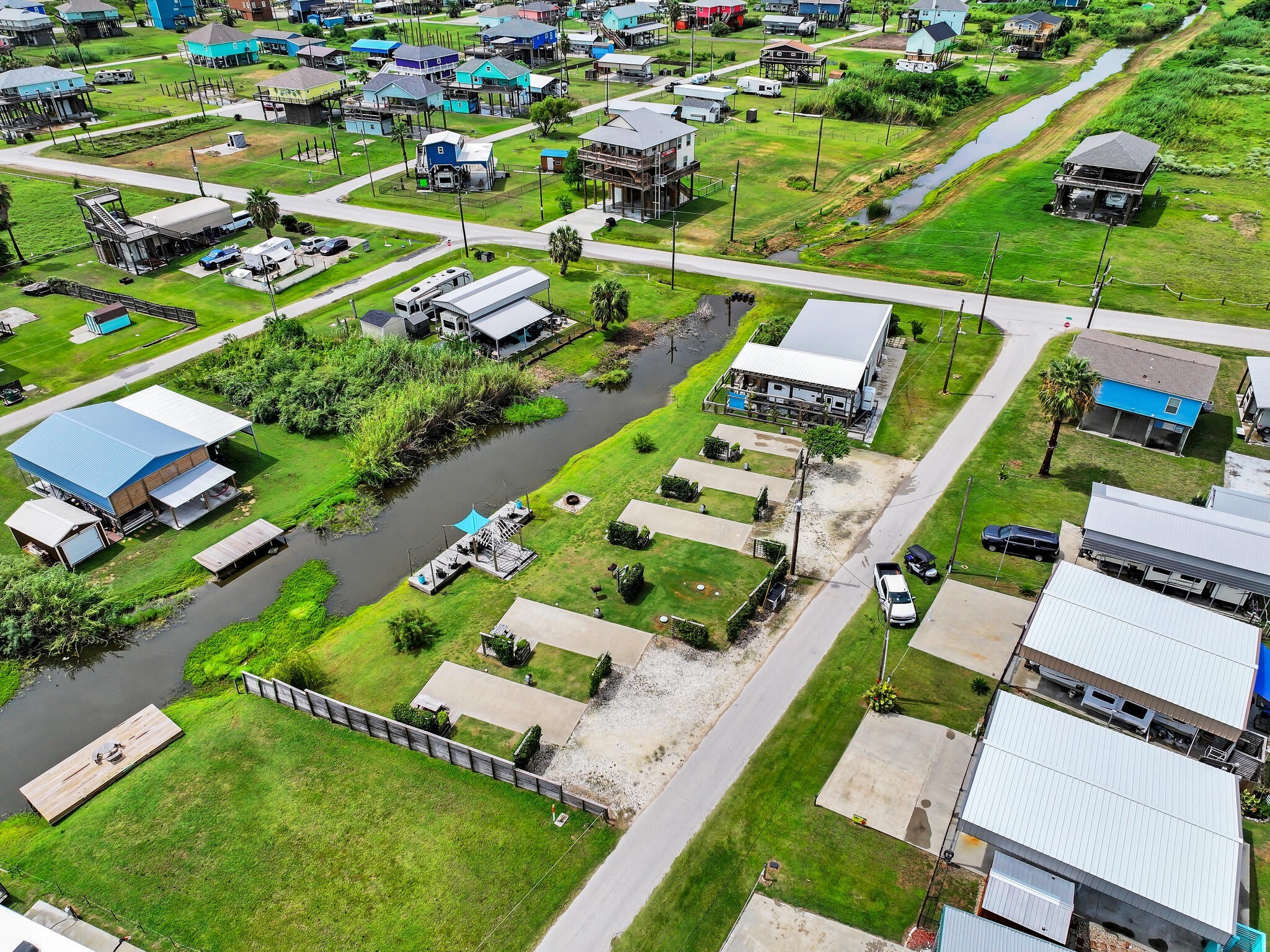 894-896 South Crystal Beach Road Crystal Beach, TX 77650 - Photo 4 of 40 an aerial view of a house with a garden
