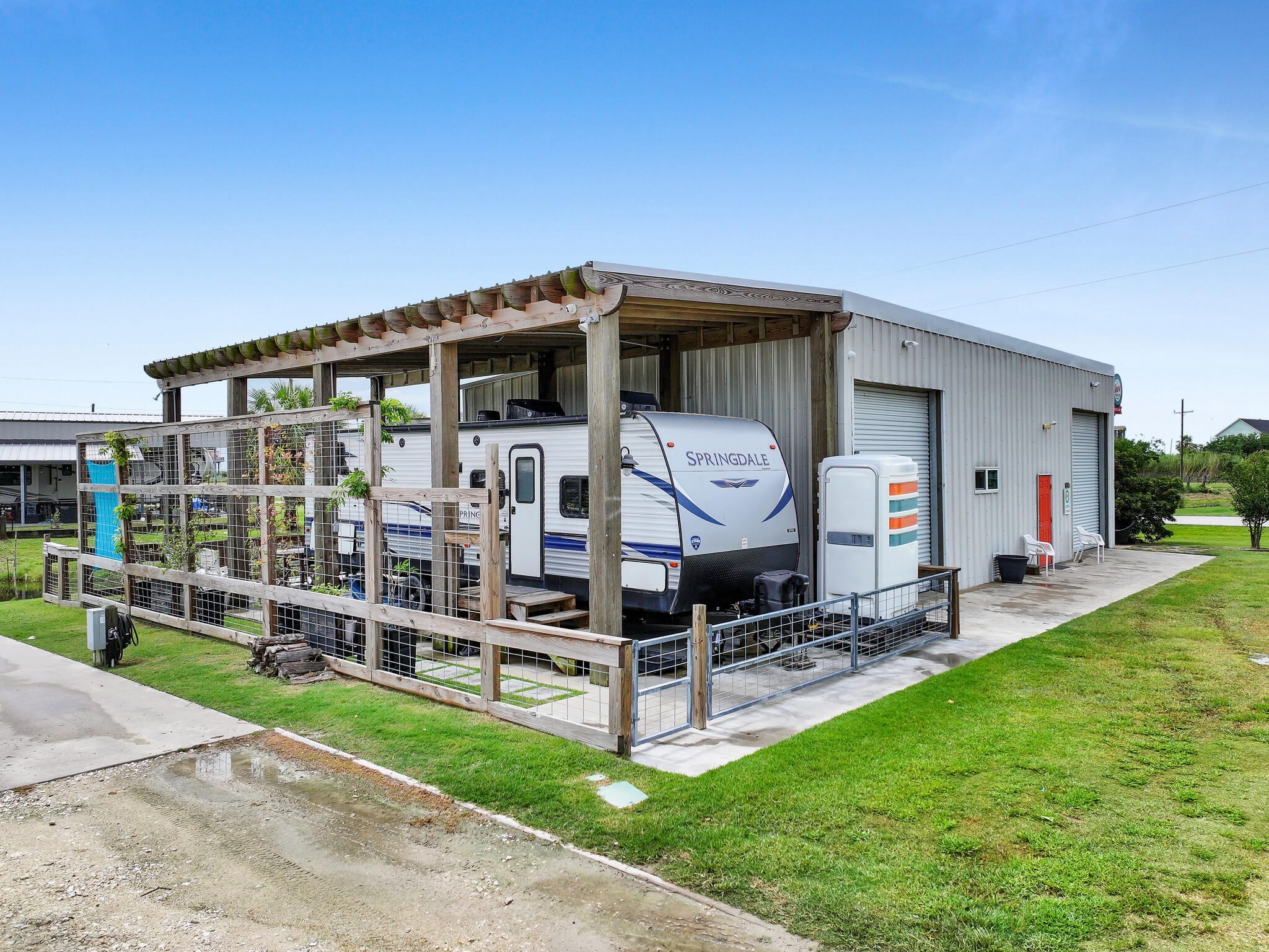 894-896 South Crystal Beach Road Crystal Beach, TX 77650 - Photo 9 of 40 a wooden bench sitting in front of a house