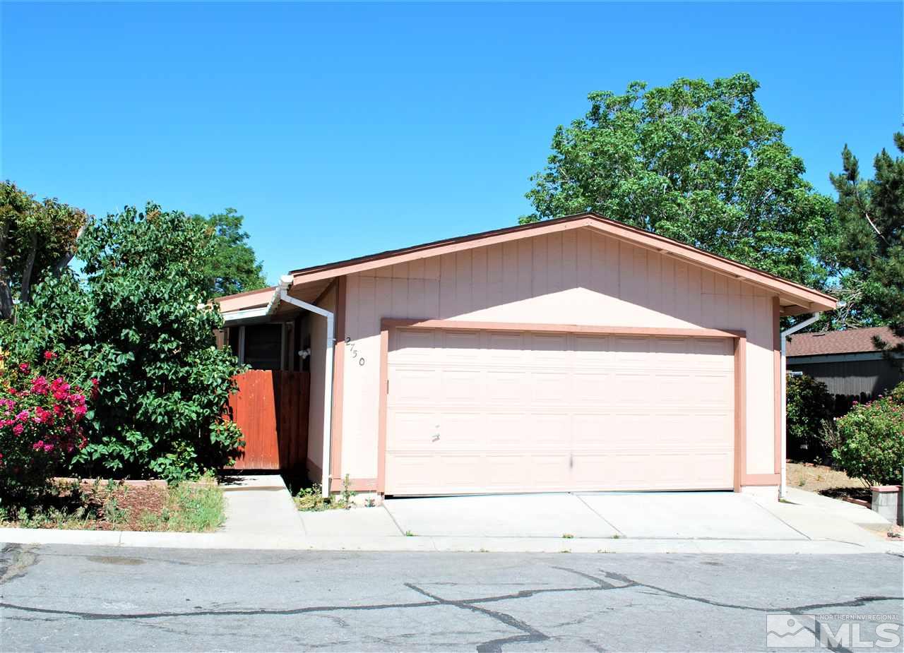 2750 Snapdragon Way Reno, NV 89512 - Photo 1 of 15 a front view of a house with a yard and garage