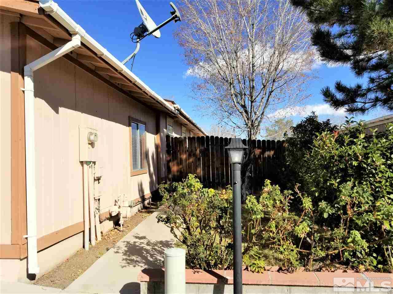 2750 Snapdragon Way Reno, NV 89512 - Photo 15 of 15 a view of a house with a yard covered in snow