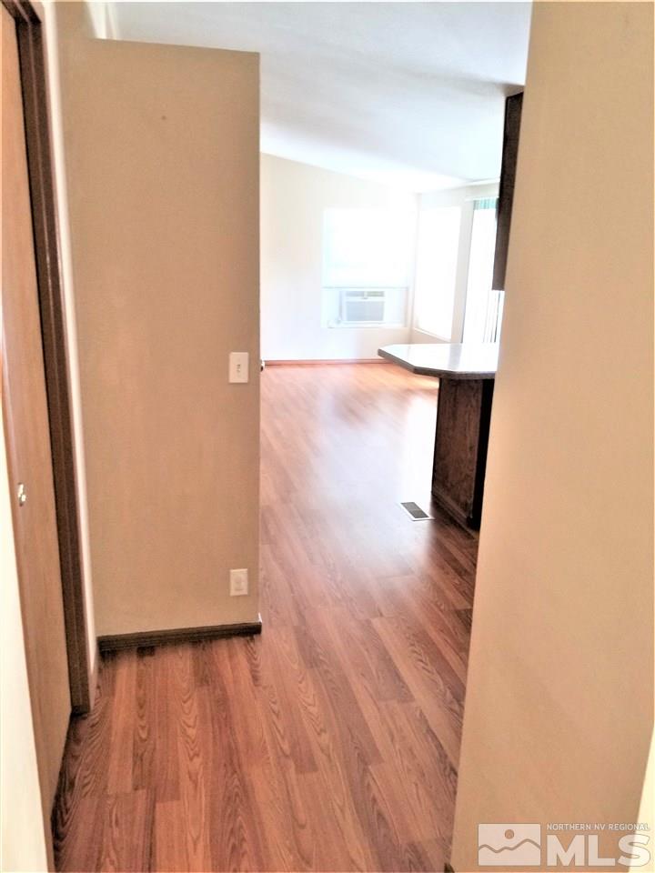 2750 Snapdragon Way Reno, NV 89512 - Photo 7 of 15 an empty room with wooden floor