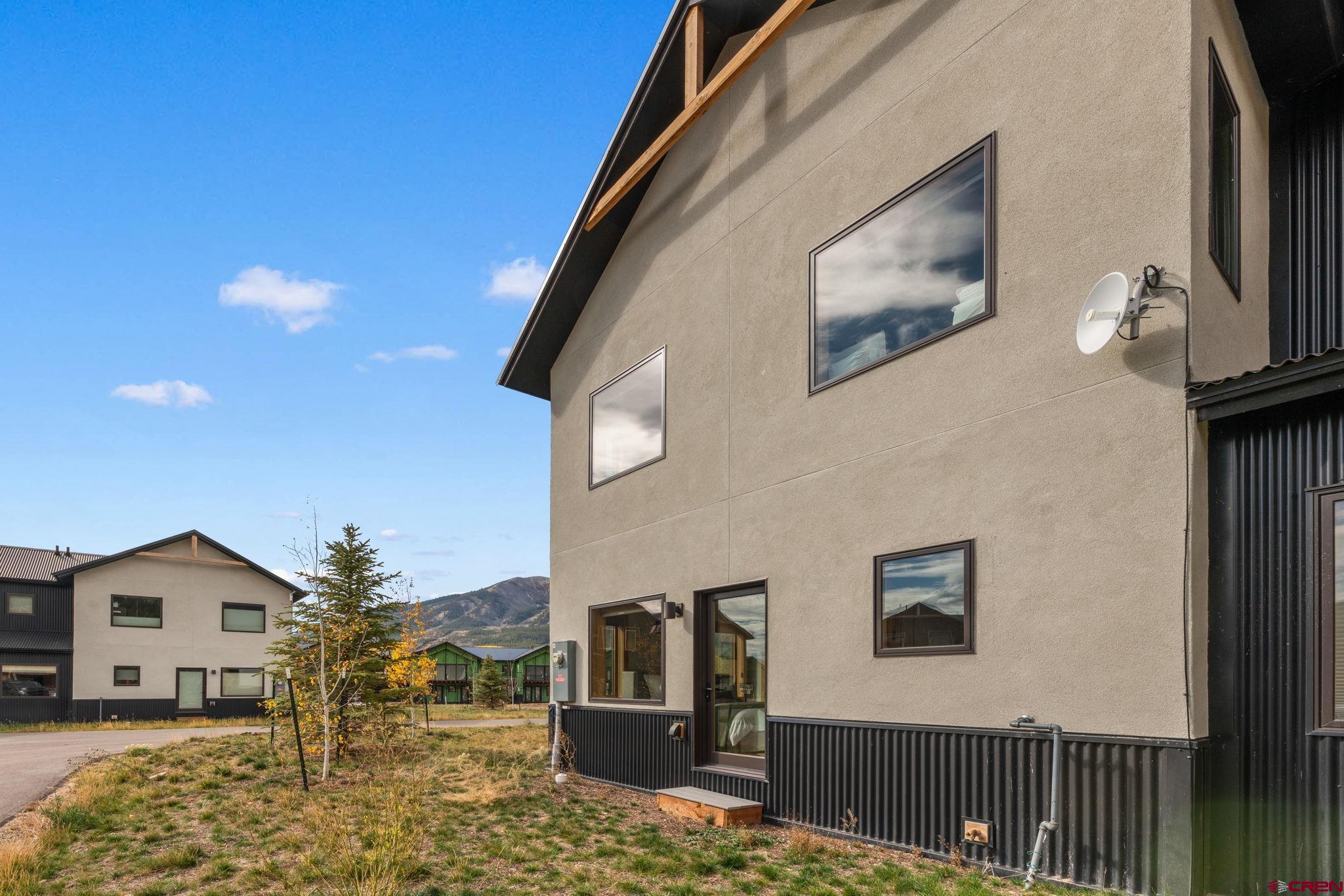 101 Elk Valley Road, Unit D Crested Butte, CO 81224 - Photo 37 of 37 a front view of a house with large windows