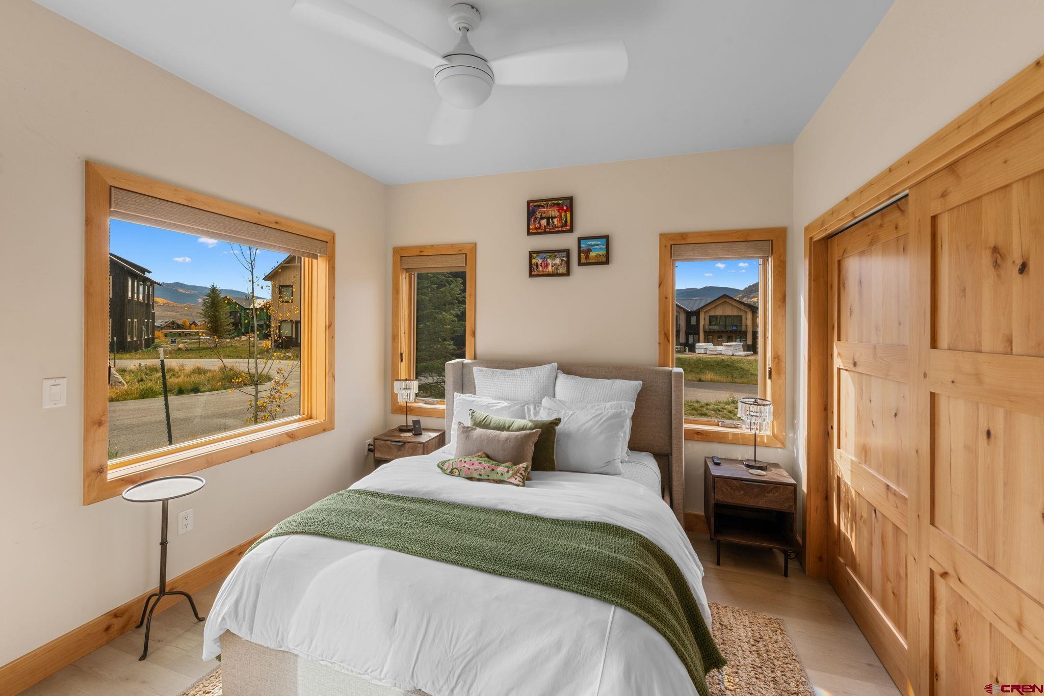 101 Elk Valley Road, Unit D Crested Butte, CO 81224 - Photo 6 of 37 a bedroom with a bed and a window