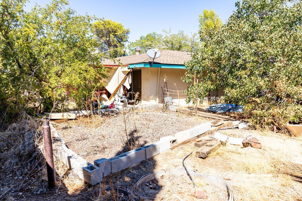 1243 Wayne Street Ridgecrest, CA 93555 - Photo 42 of 42 a view of a backyard with a tree