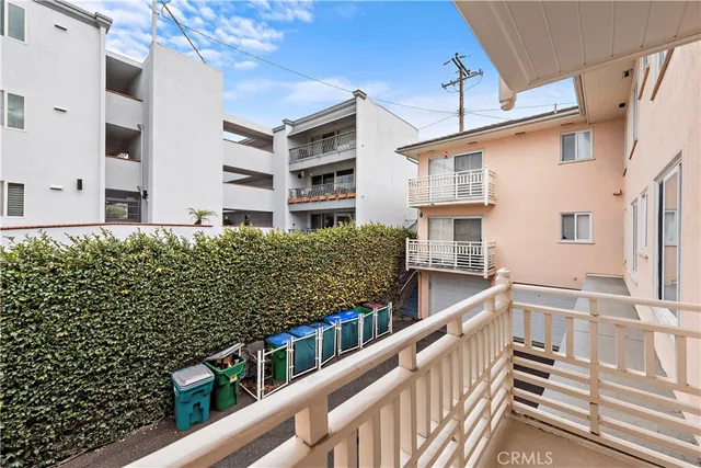 a view of a balcony with chairs
