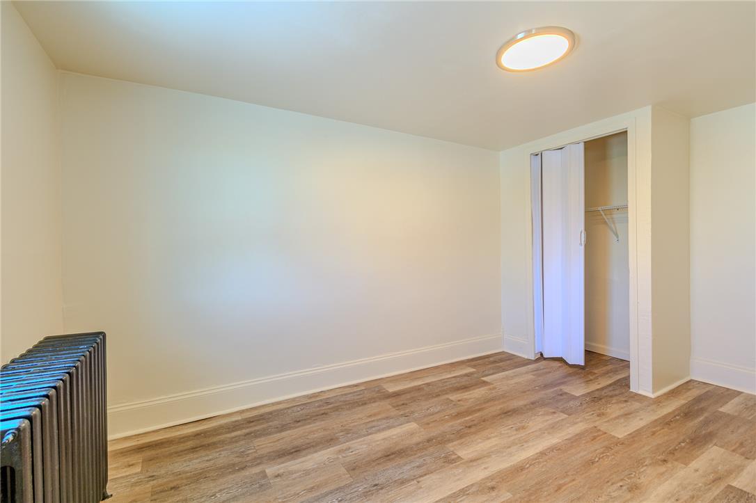 820 North 5th Street Allentown, PA 18102 - Photo 32 of 39 A versatile room features attractive wood-look flooring and a convenient built-in closet.