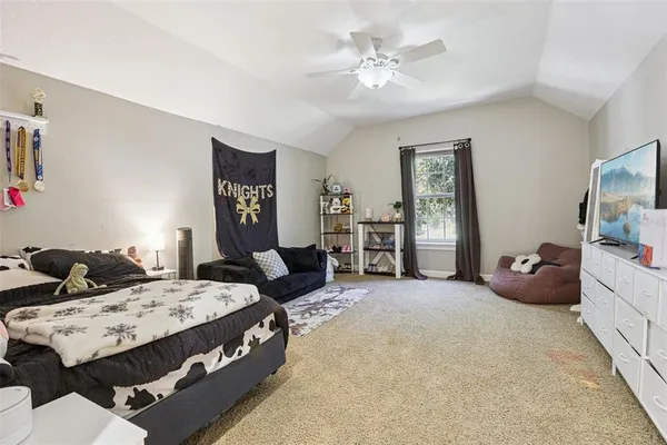 a living room with furniture and flat screen tv