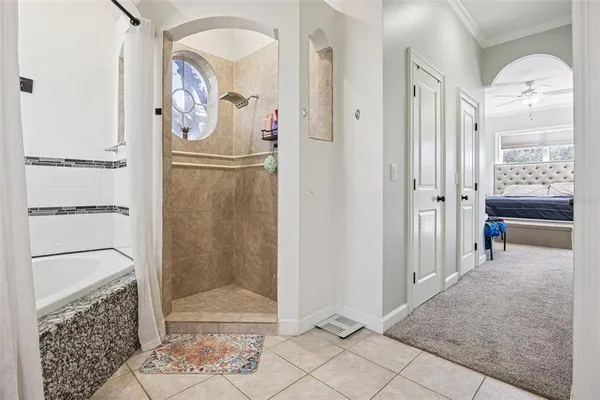 a bathroom with a glass shower door