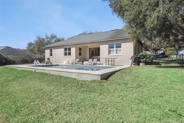a house view with outdoor space and garden