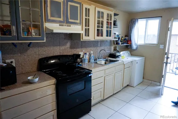 a kitchen with a sink and cabinets