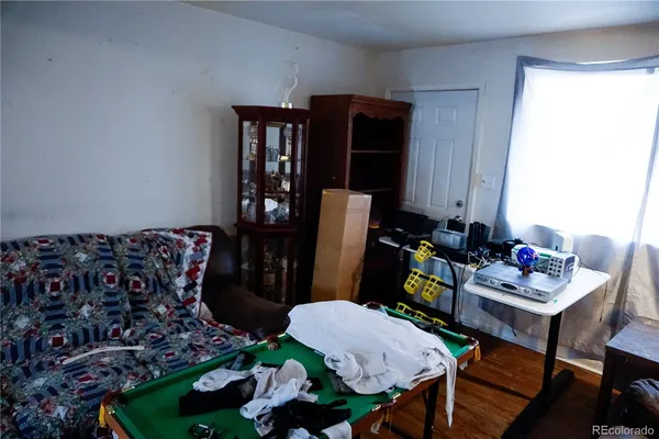 a bed room with furniture and a potted plant