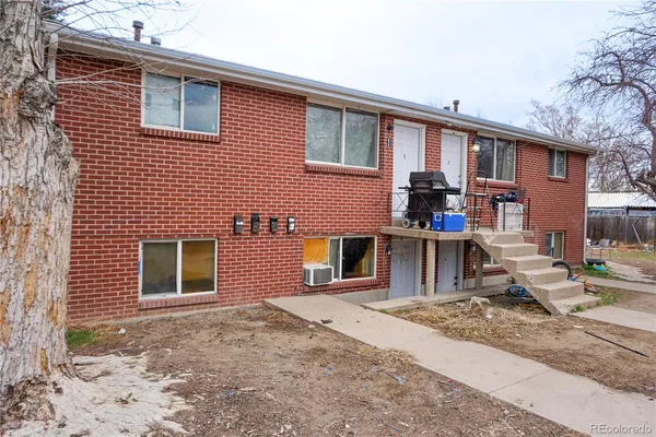 a front view of a house with large windows
