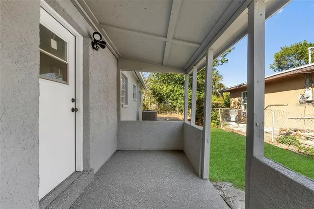 a view of porch with green space