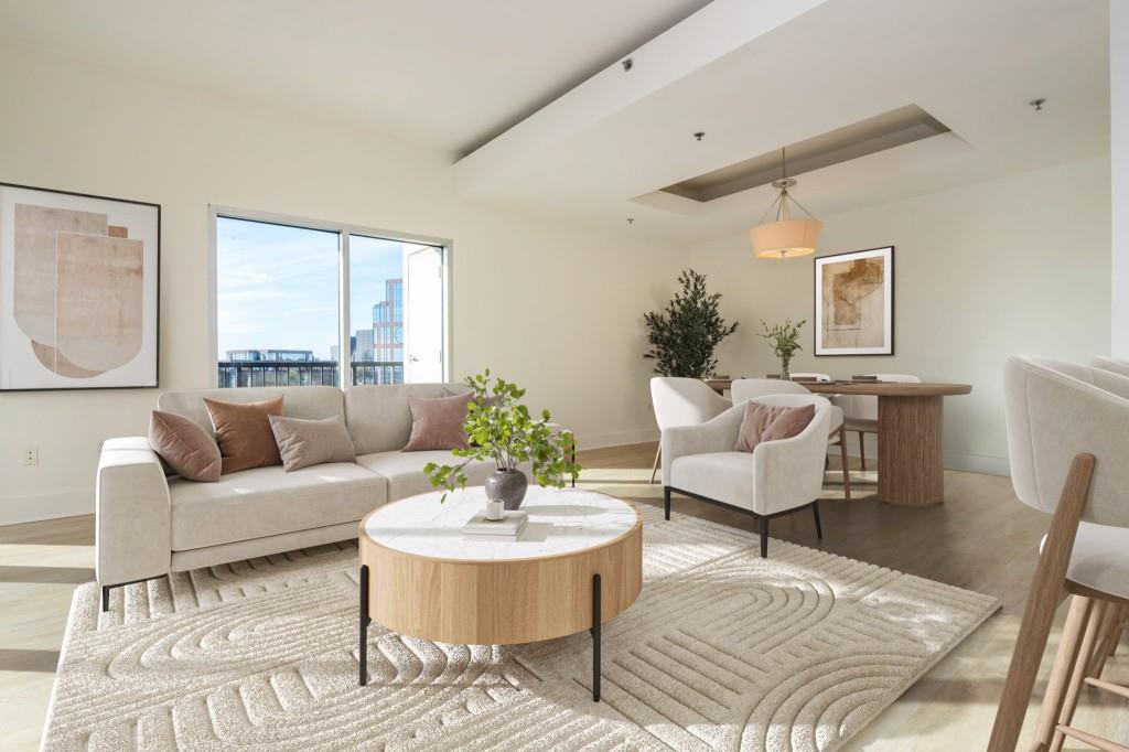 4561 Olde Perimeter Way, Unit 1701 Atlanta, GA 30346 - Photo 11 of 64 a living room with furniture and a wooden floor