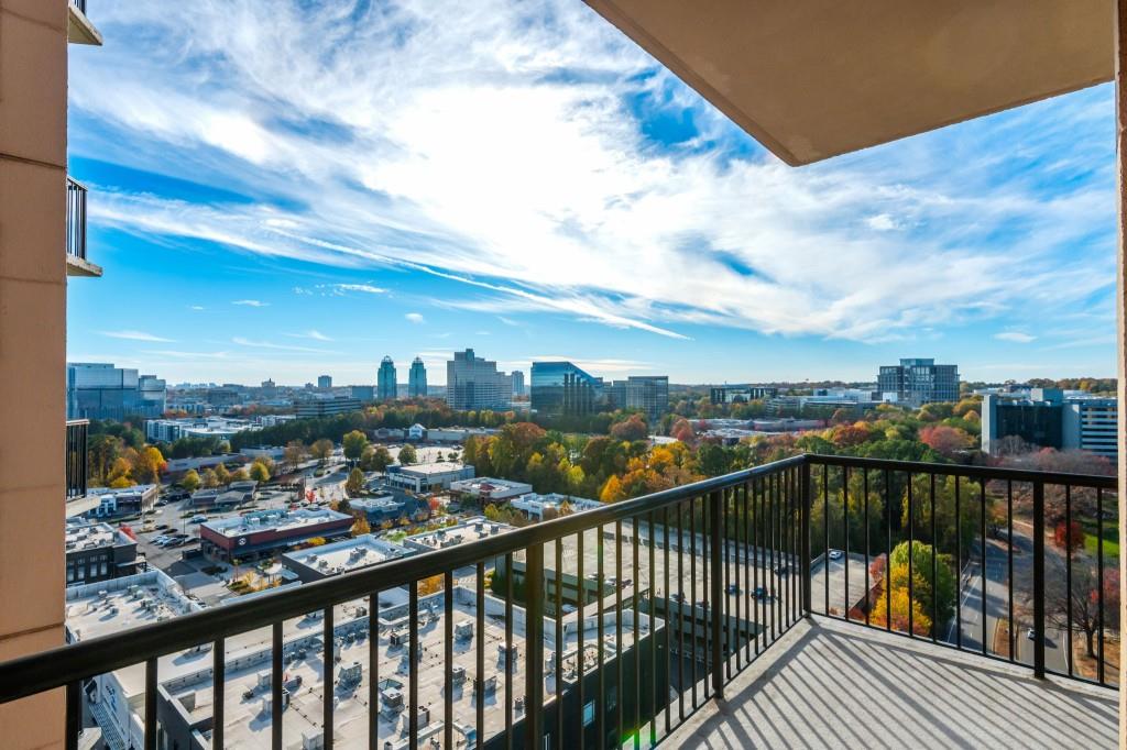 4561 Olde Perimeter Way, Unit 1701 Atlanta, GA 30346 - Photo 19 of 64 a view of a city skyline from a balcony