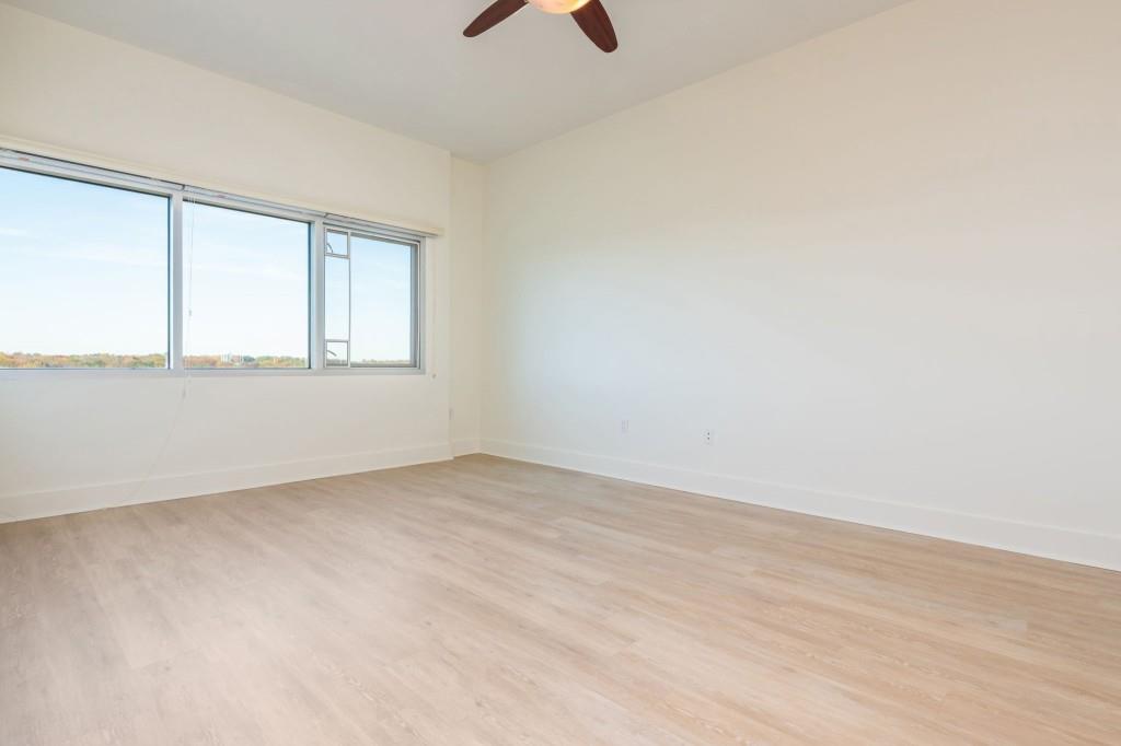 4561 Olde Perimeter Way, Unit 1701 Atlanta, GA 30346 - Photo 23 of 64 an empty room with a window