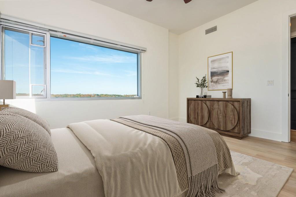 4561 Olde Perimeter Way, Unit 1701 Atlanta, GA 30346 - Photo 31 of 64 a bedroom with a bed and window