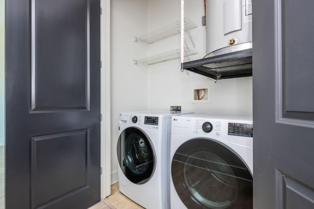 4561 Olde Perimeter Way, Unit 1701 Atlanta, GA 30346 - Photo 34 of 64 a utility room with dryer and washer