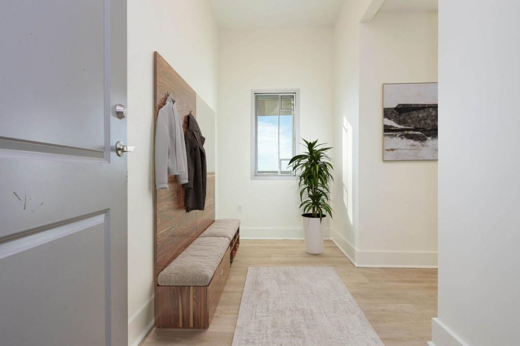 4561 Olde Perimeter Way, Unit 1701 Atlanta, GA 30346 - Photo 4 of 64 a hallway with with furniture and a livingroom