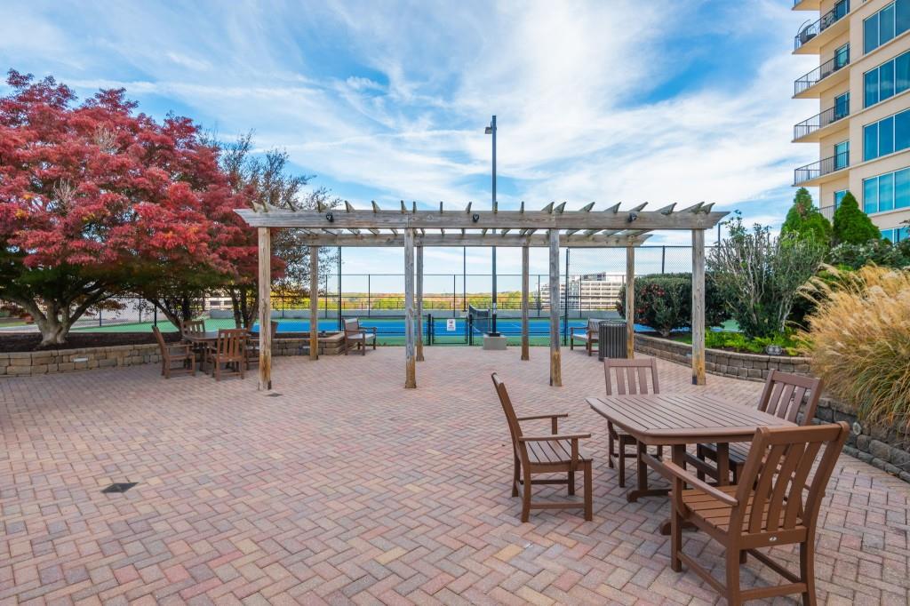 4561 Olde Perimeter Way, Unit 1701 Atlanta, GA 30346 - Photo 50 of 64 a view of outdoor space with seating area and barbeque oven