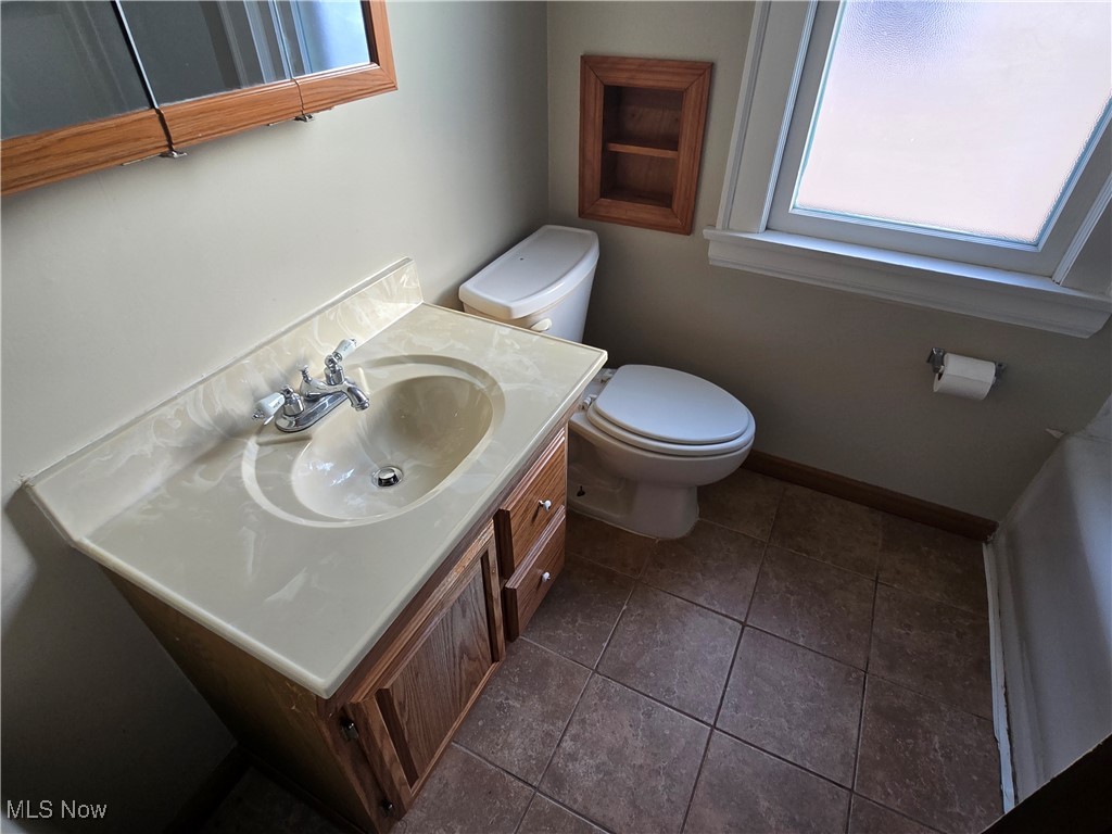 2048 Rossmoor Road Cleveland Heights, OH 44118 - Photo 19 of 29 Full bathroom featuring vanity and dark tile patterned floors