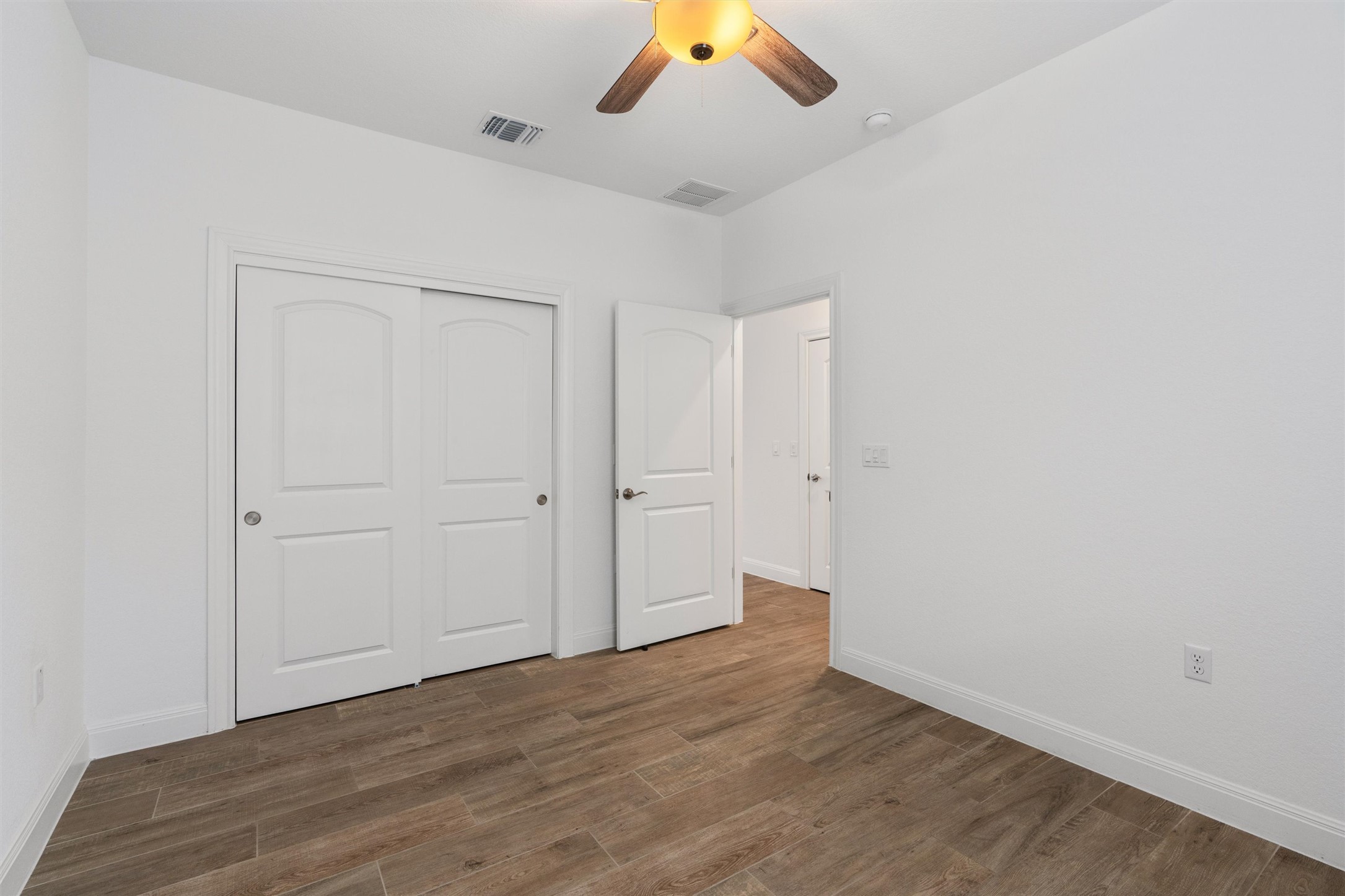 202 Spanish Star Street Georgetown, TX 78633 - Photo 24 of 32 wooden floor in an empty room