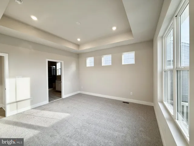 a bathroom with a granite countertop sink mirror and shower